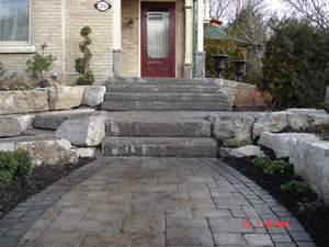 After: interlocking stone walkway with stone steps and block stone retaining walls at M. residence