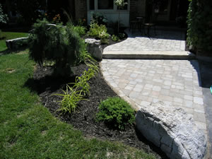 After: interlocking brick and stone front walkway