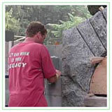 Responsible staff working on moon arch stone structure